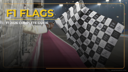 Collection of F1 flags including yellow, red, and chequered flag displayed at a Formula 1 circuit