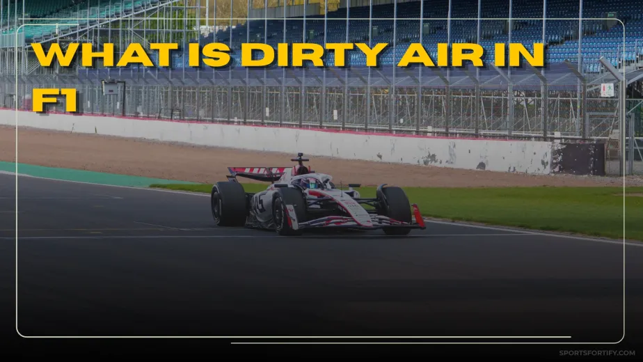 Formula 1 car following closely behind another through a corner losing downforce in dirty air turbulence
